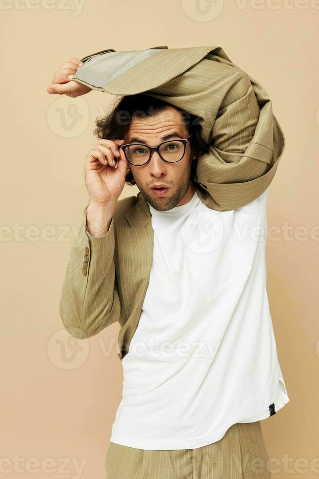 Cheerful man spectacled beige suit elegant style isolated background photo