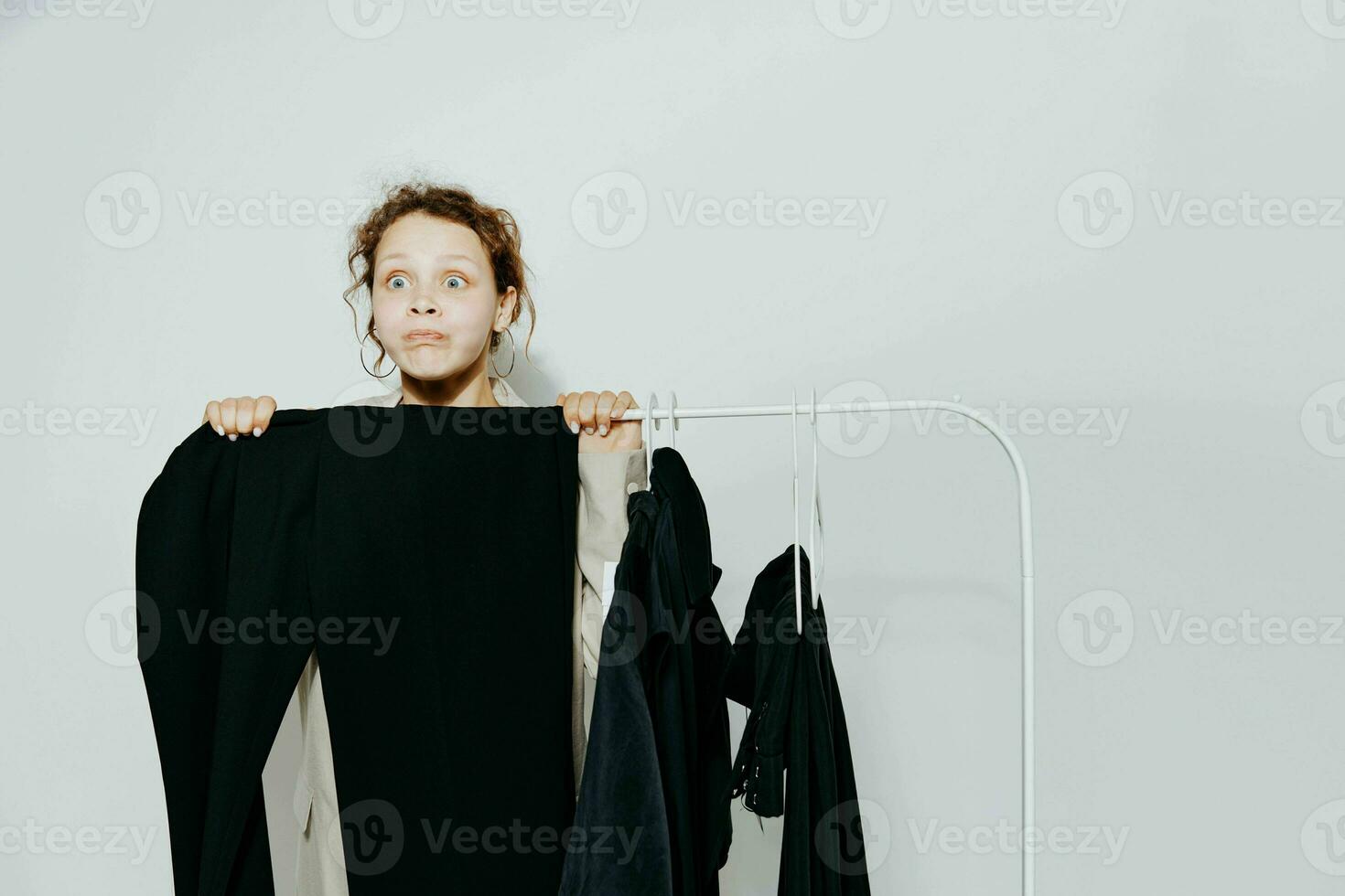 beautiful woman in a suit gestures with his hands wardrobe Lifestyle unaltered photo