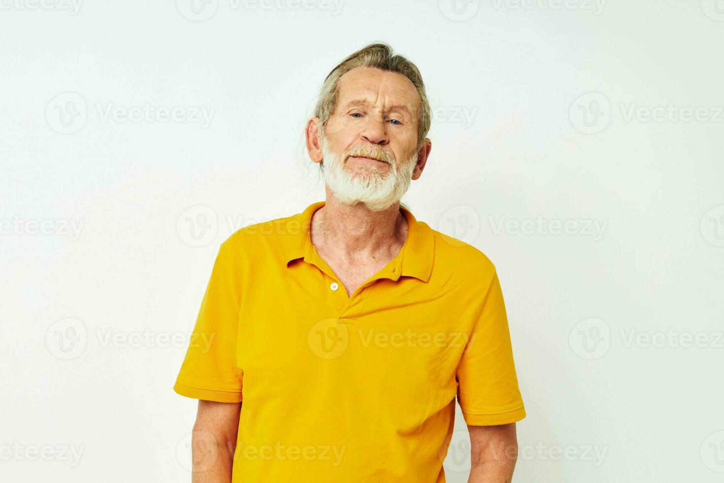 Senior grey-haired man with a gray beard emotion gestures hands light background photo