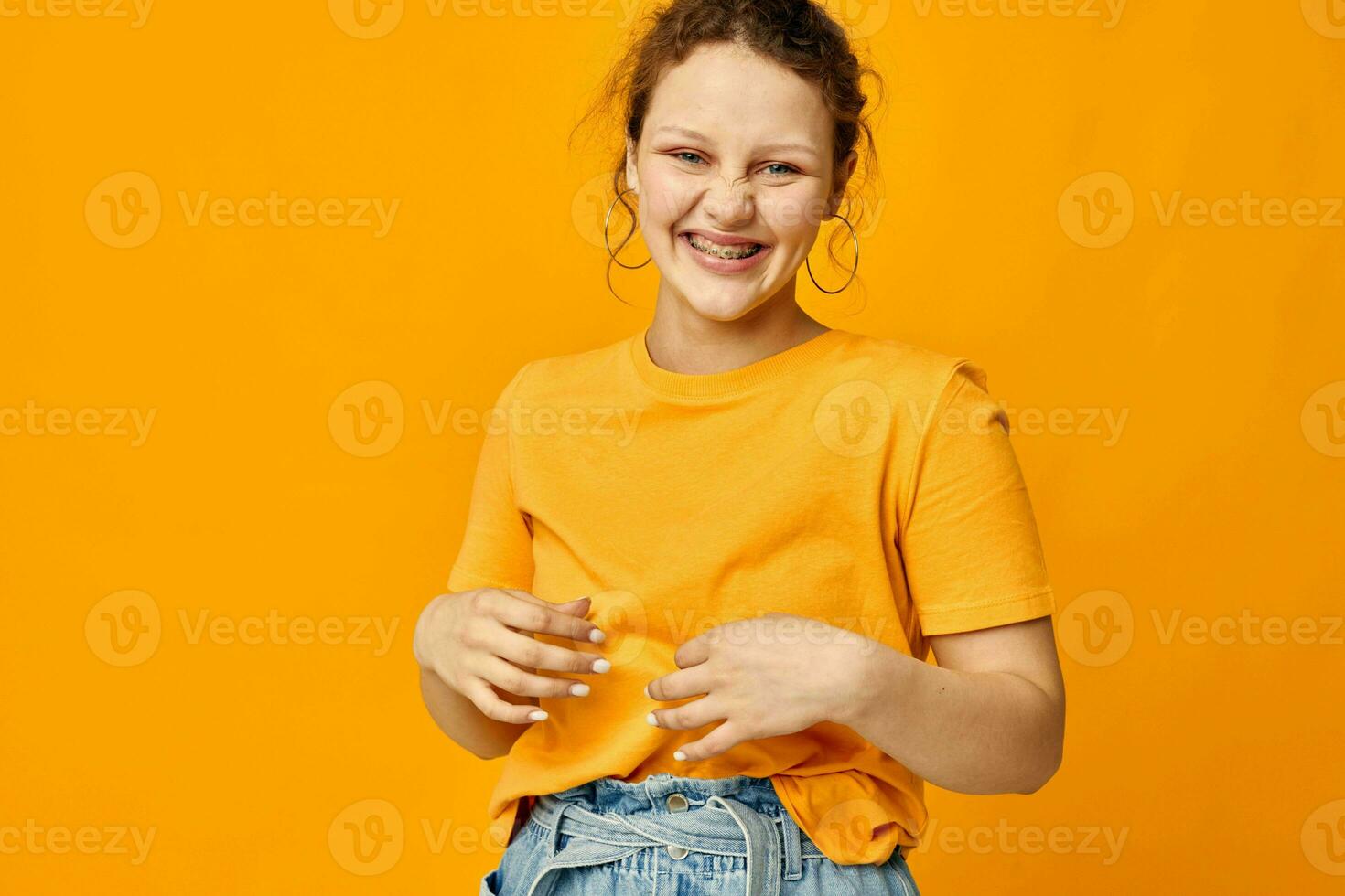 beautiful woman in a yellow t-shirt posing emotions Lifestyle unaltered photo