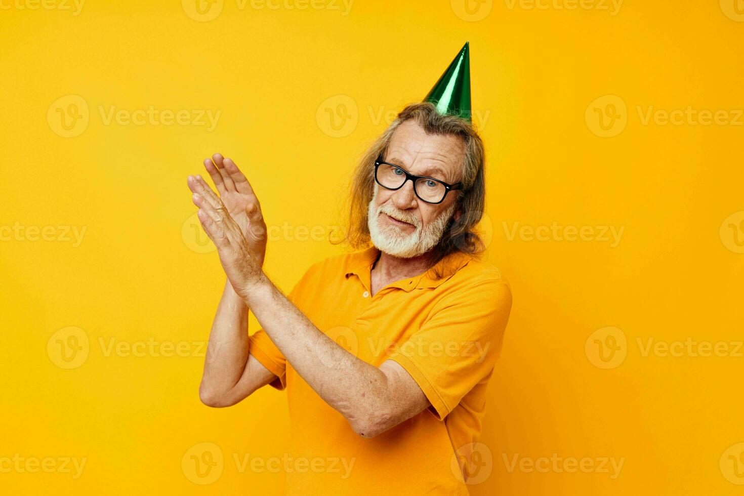 elderly man in a yellow t-shirt with a cap on his head fun monochrome shot photo