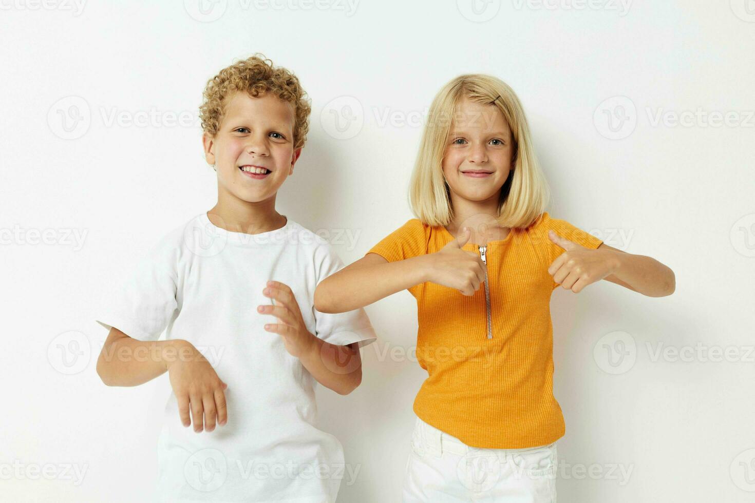 picture of positive boy and girl casual clothes posing emotions studio isolated background unaltered photo