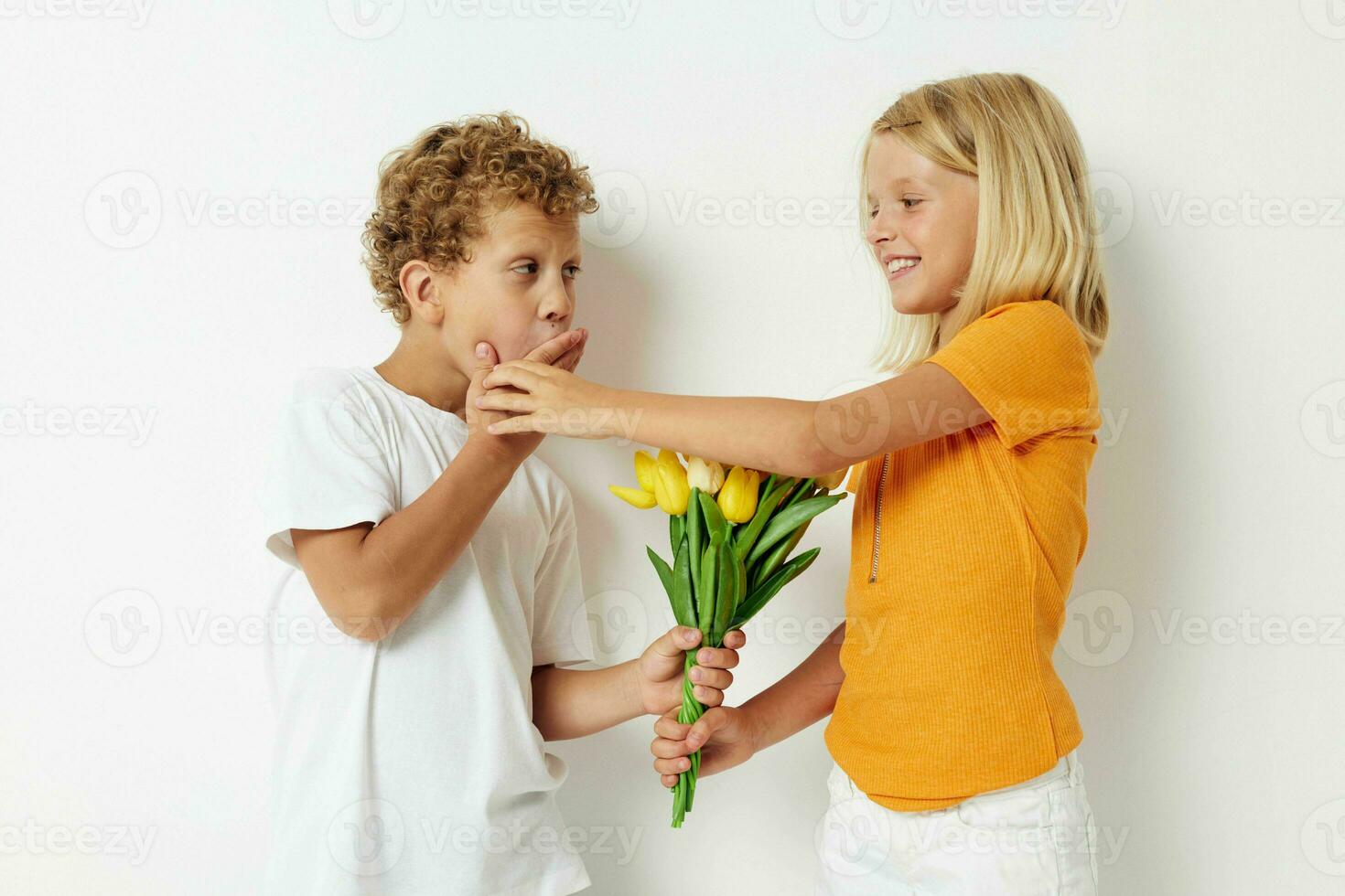 cheerful children fun birthday gift surprise bouquet of flowers isolated background unaltered photo