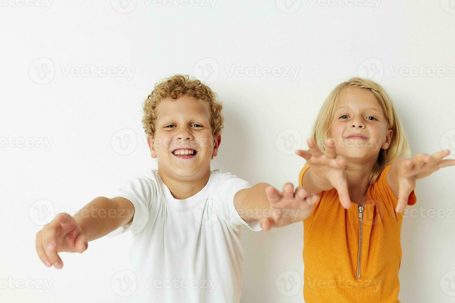 Cute preschool kids posing hand gesture smile casual wear isolated background unaltered photo