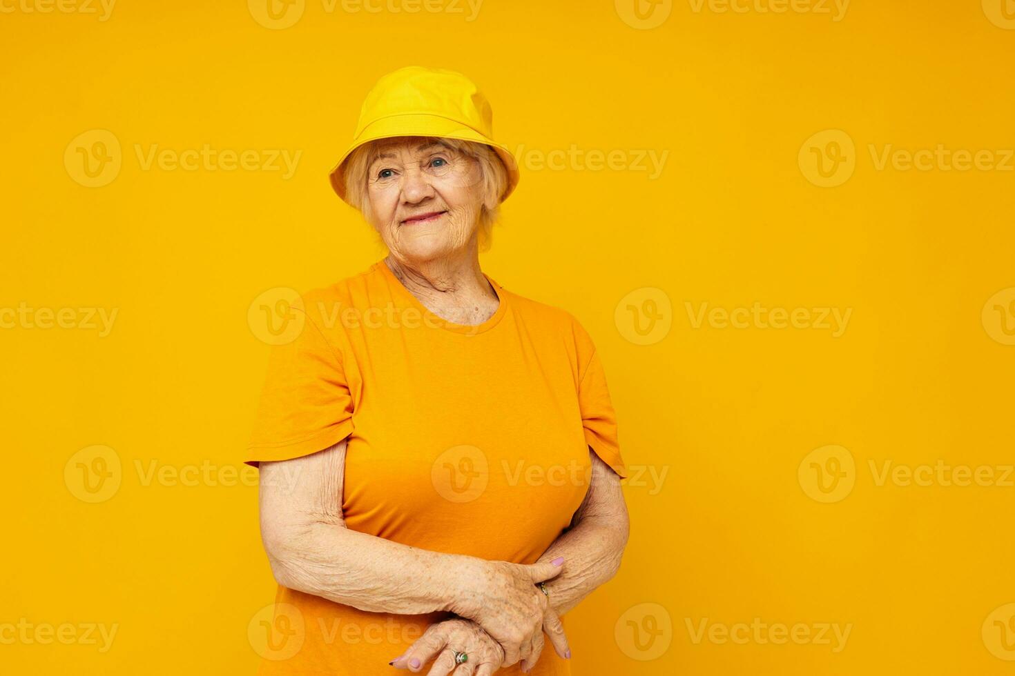 smiling elderly woman happy lifestyle in a yellow headdress close-up emotions photo