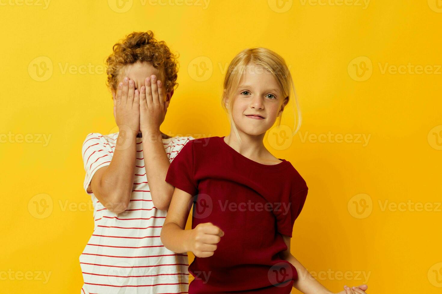 cheerful children cuddling fashion childhood entertainment yellow background photo