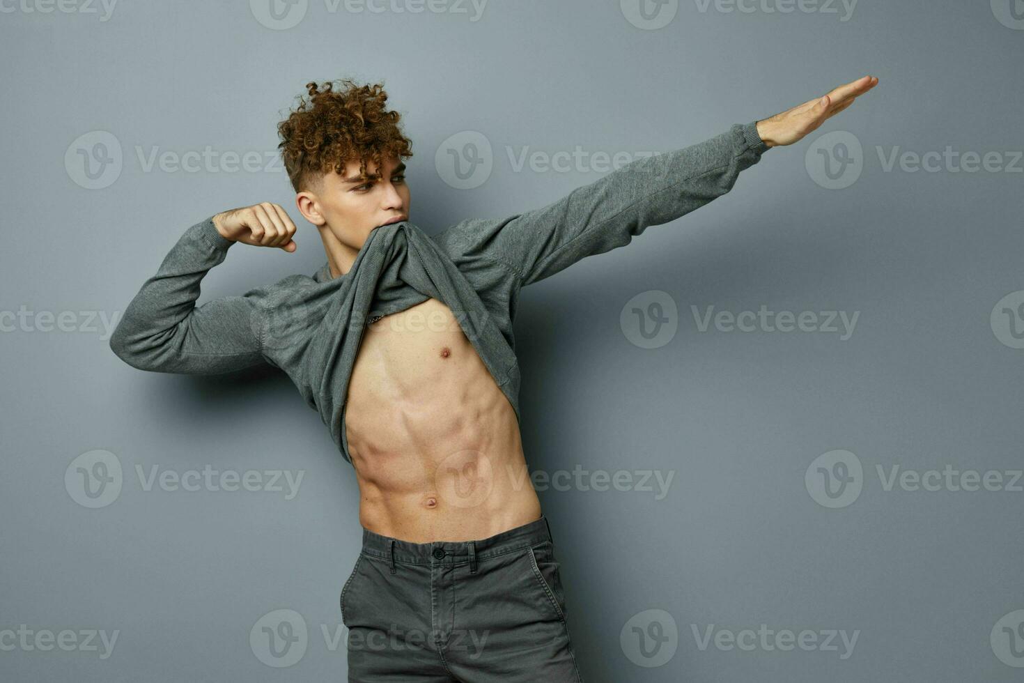 handsome young man sexy posing self confidence isolated background photo