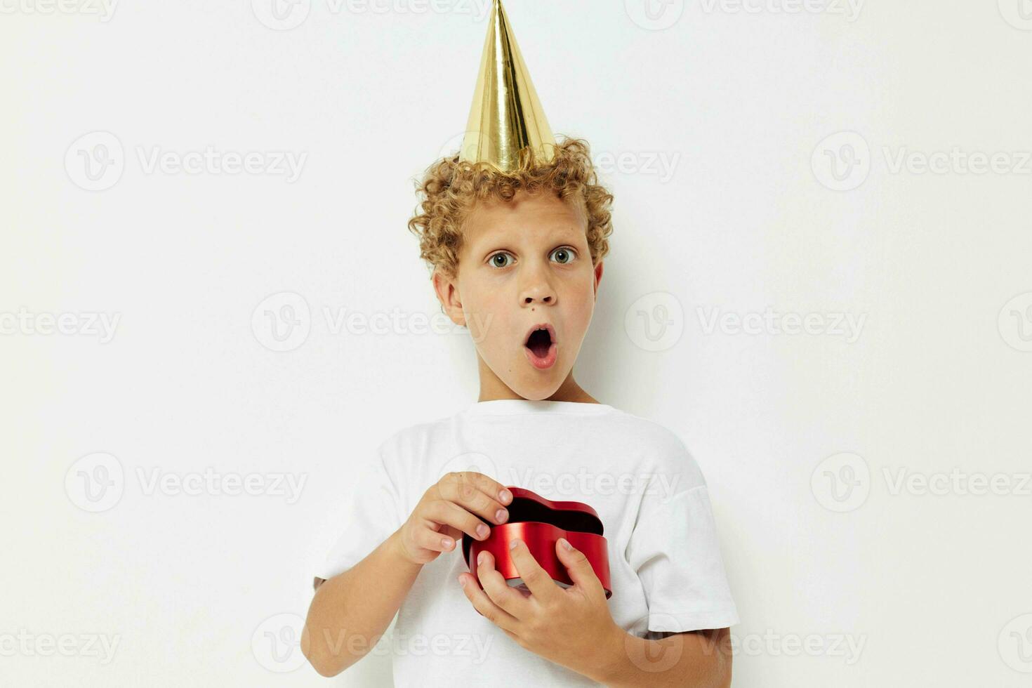 little boy wearing a white t-shirt with a cap on his head birthday gift photo