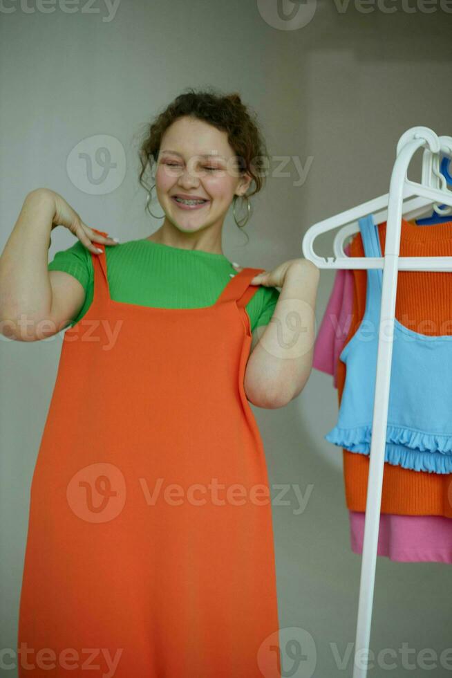 portrait of a young woman trying on clothes wardrobe Youth style cropped view unaltered photo