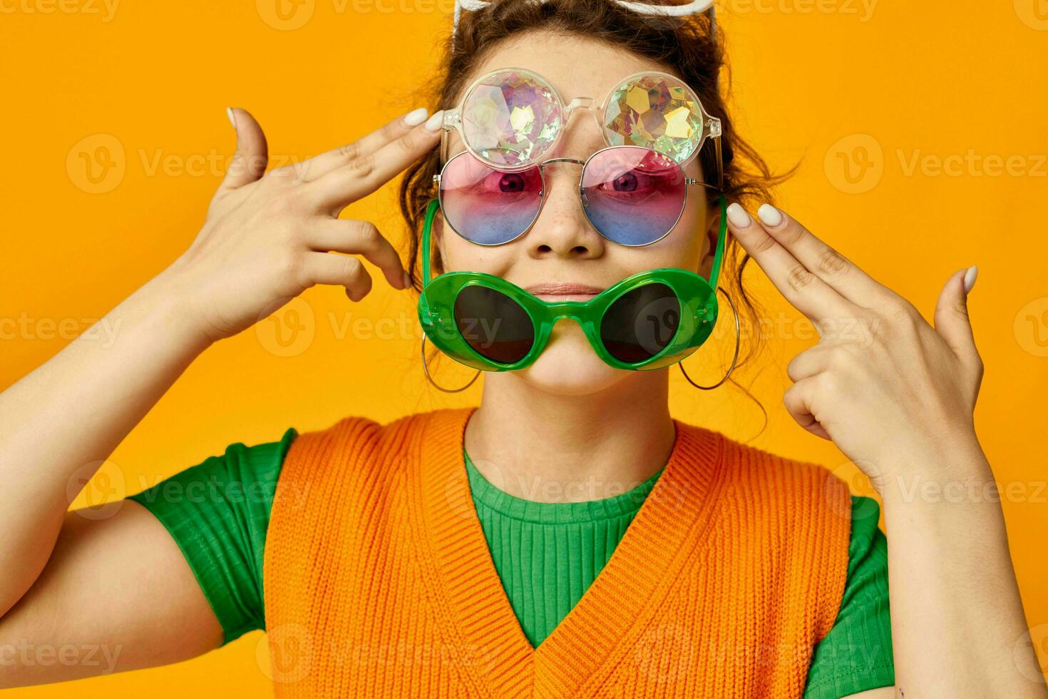 pretty girl orange sweatshirts sunglasses multicolored glasses supply yellow background unaltered photo