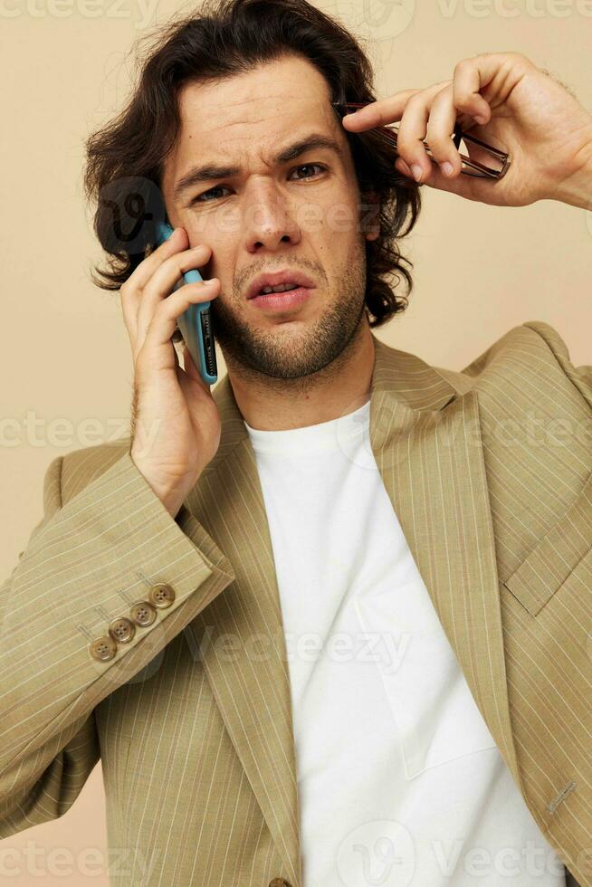 Attractive man talking on the phone technologies isolated background photo