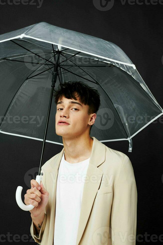 guy with transparent open umbrella suit elegant style photo