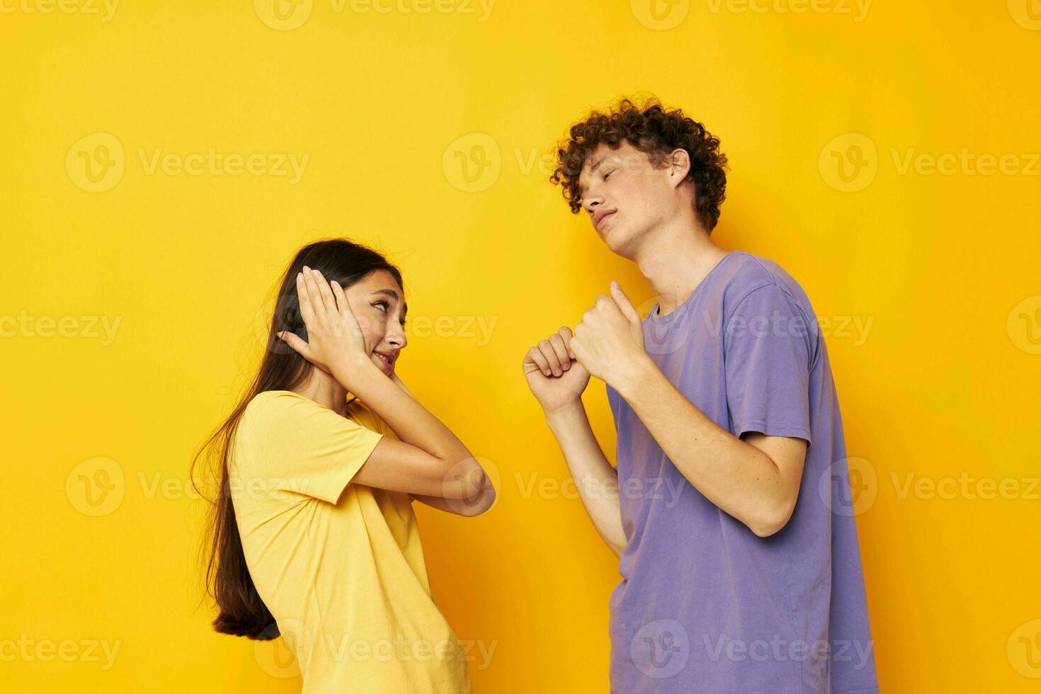 portrait of a man and a woman casual clothes posing emotions antics isolated background unaltered photo
