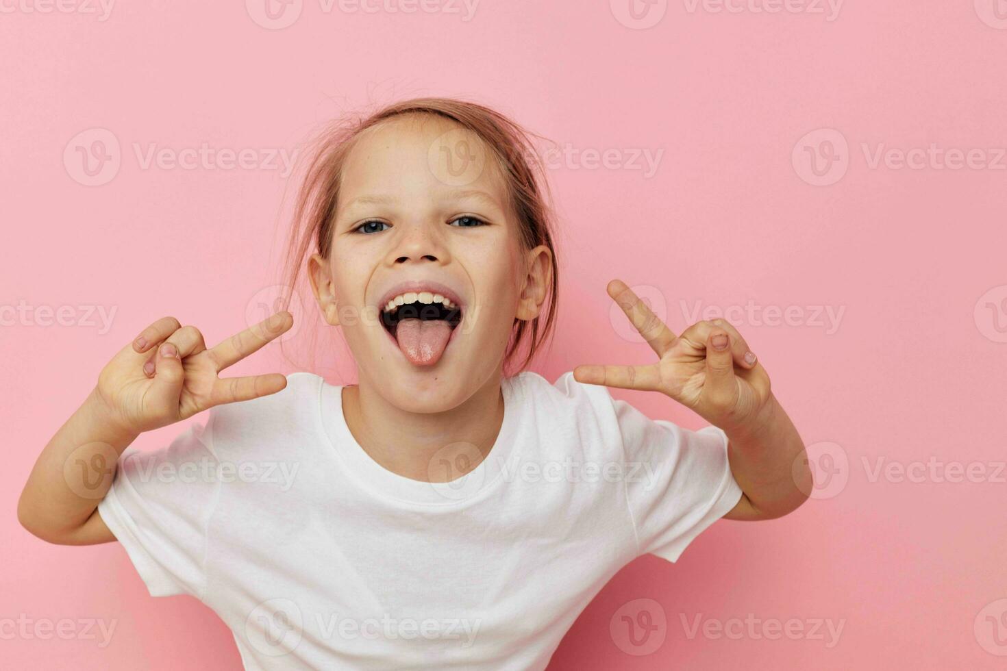 Portrait of happy smiling child girl grimace posing fun Lifestyle unaltered photo