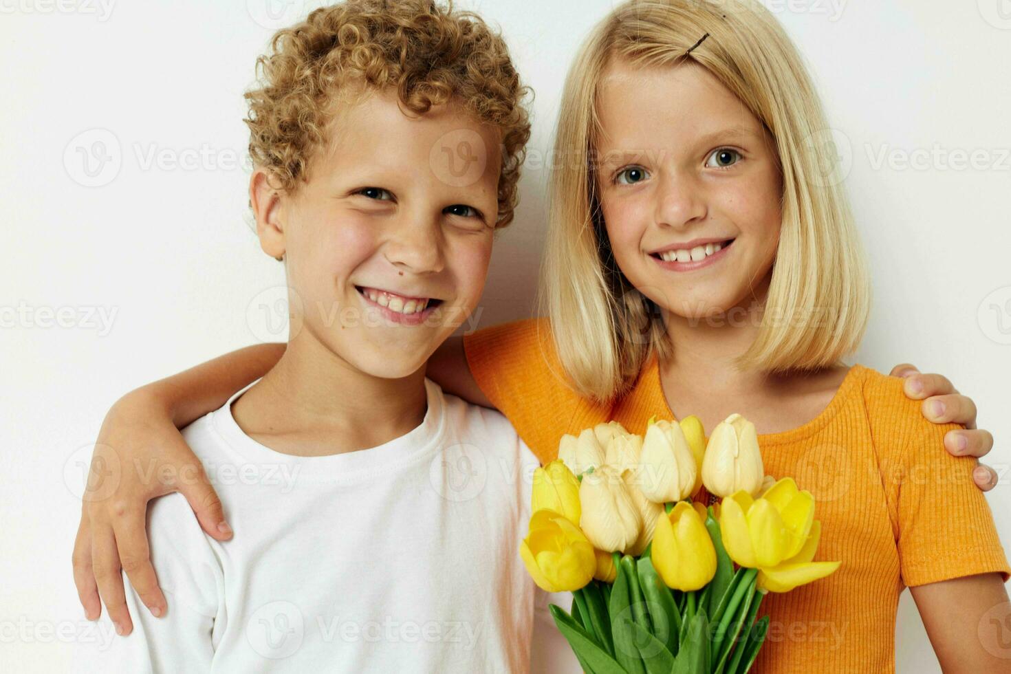 Small children fun birthday gift surprise bouquet of flowers isolated background unaltered photo