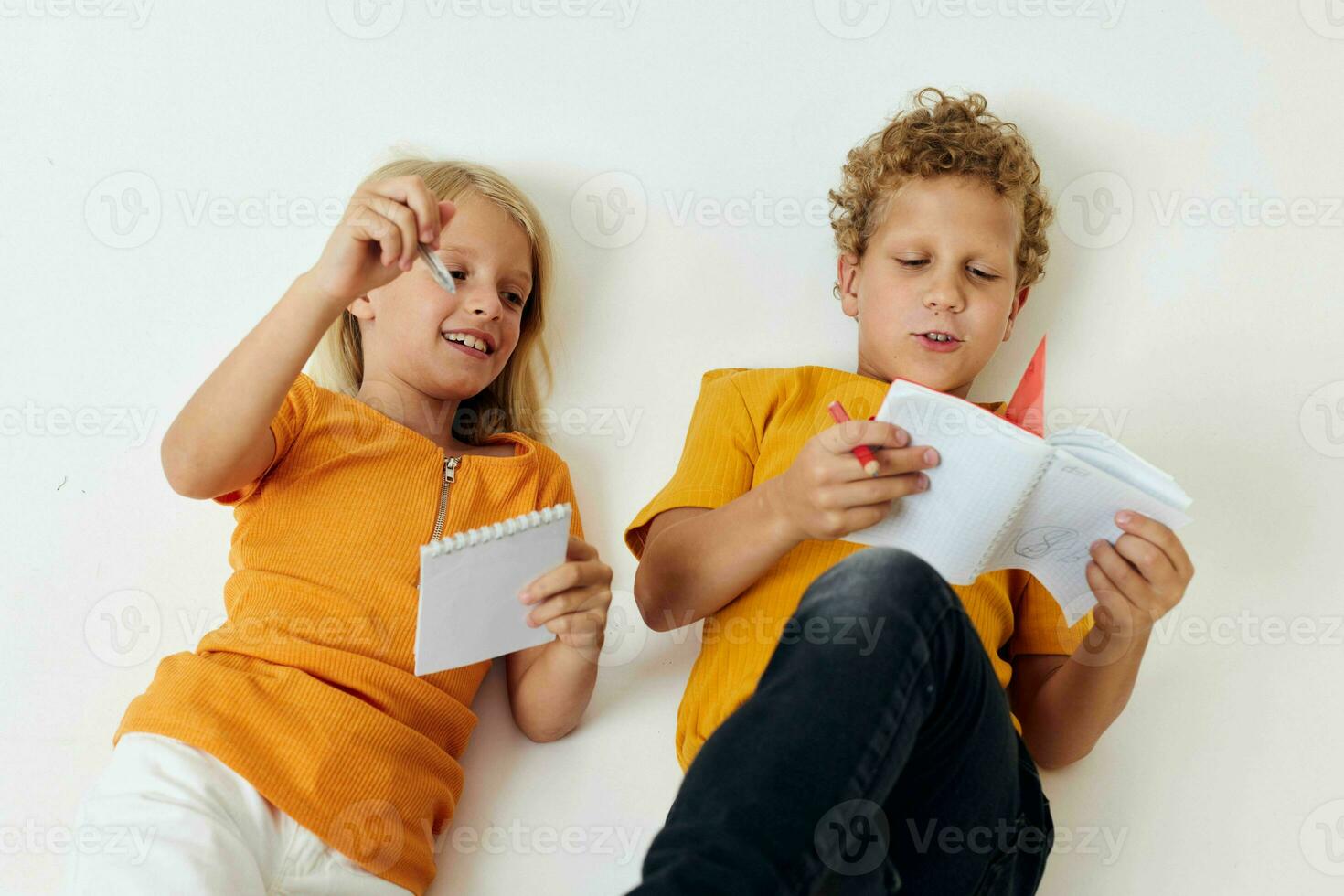 Portrait of cute drawing in notebooks lying on the floor light background unaltered photo