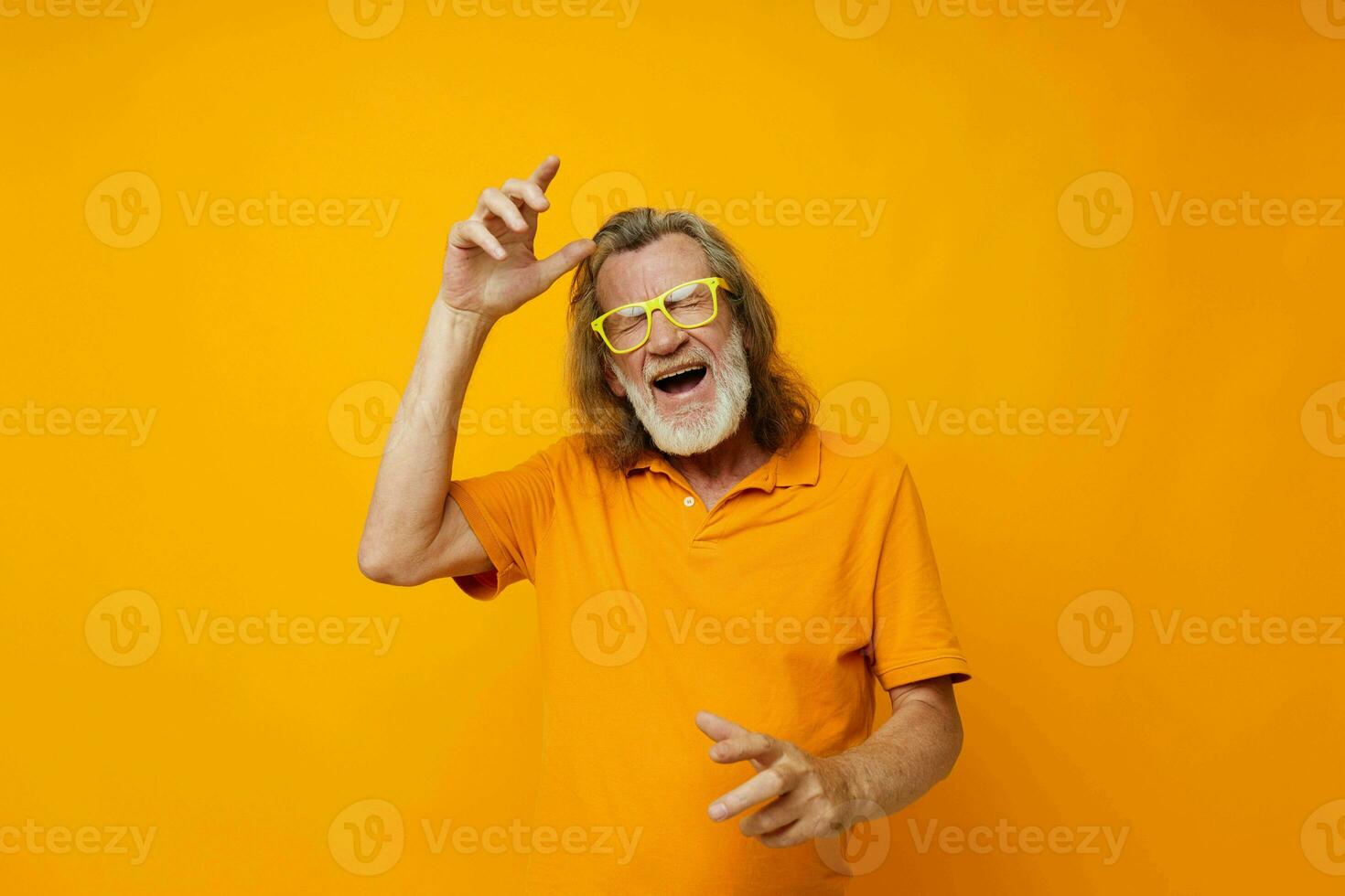 old man in yellow glasses with a gray beard emotions monochrome shot photo