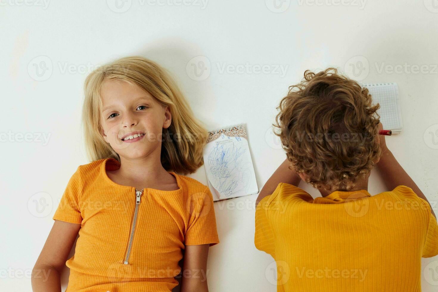 picture of positive boy and girl childhood entertainment drawing isolated background unaltered photo