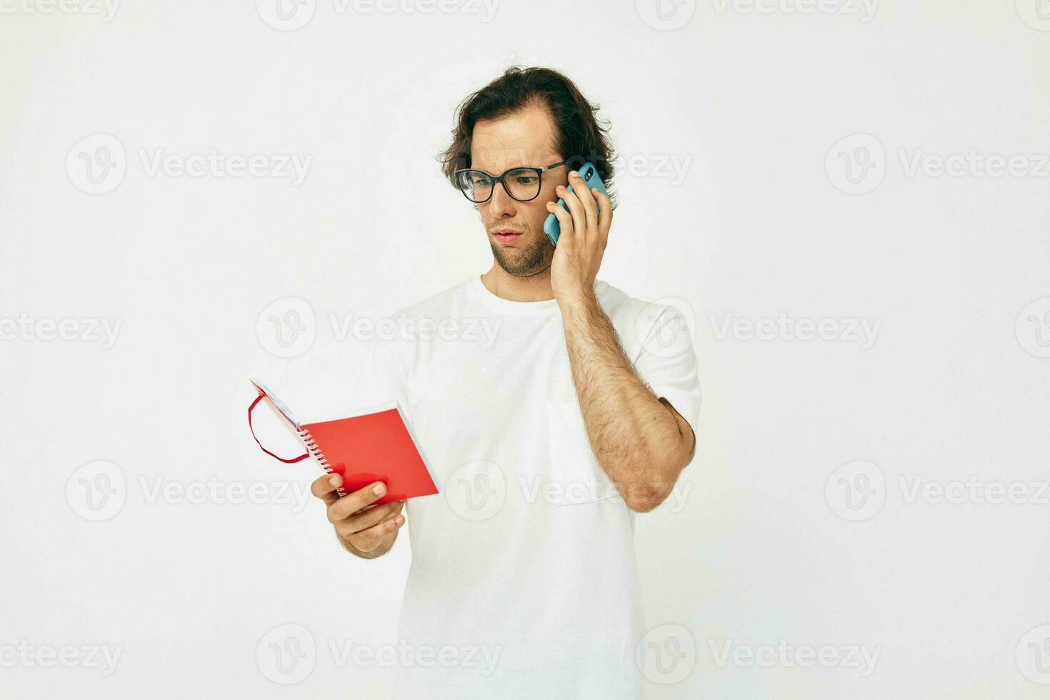 Attractive man red notepad telephone communication Lifestyle unaltered photo