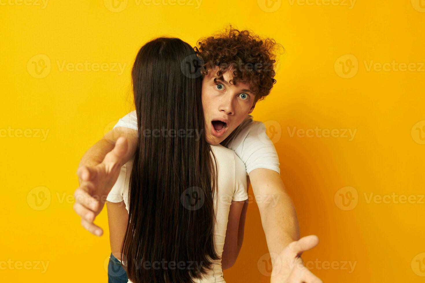 cute young couple stand hugging each other in white T-shirts isolated background unaltered photo
