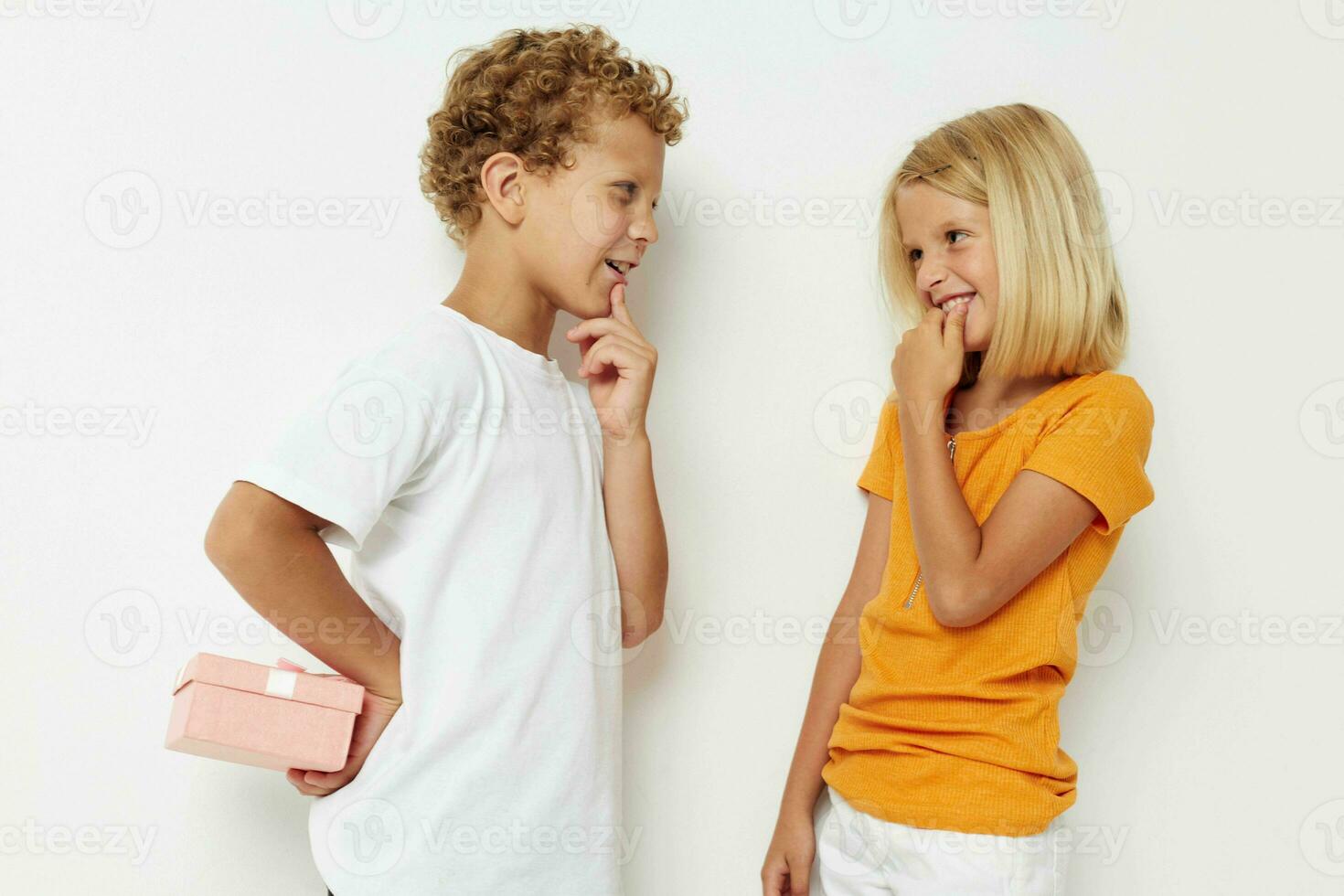 Boy and girl holiday friendship with a gift lifestyle unaltered photo