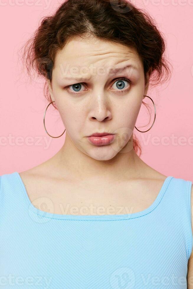 portrait of a young woman posing fashion modern style pink background unaltered photo