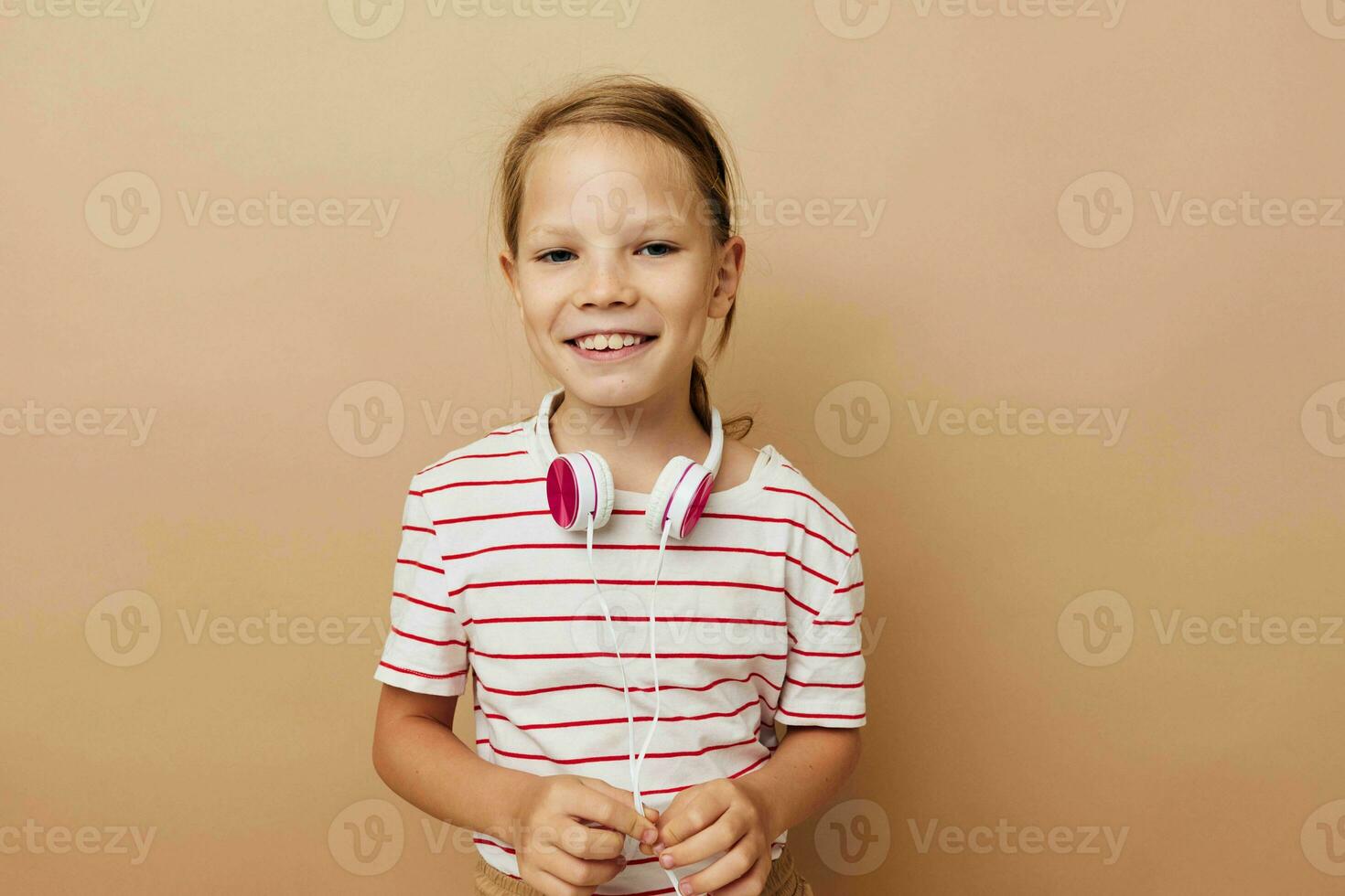 Portrait of happy smiling child girl headphone technology fun music Lifestyle unaltered photo