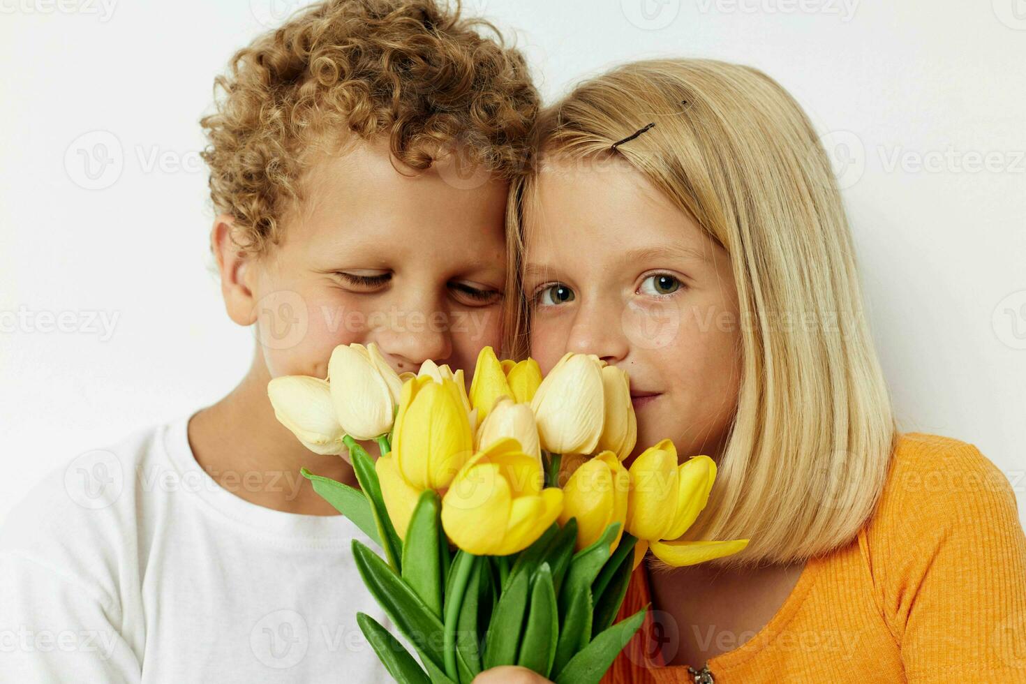 picture of positive boy and girl fun birthday gift surprise bouquet of flowers lifestyle unaltered photo