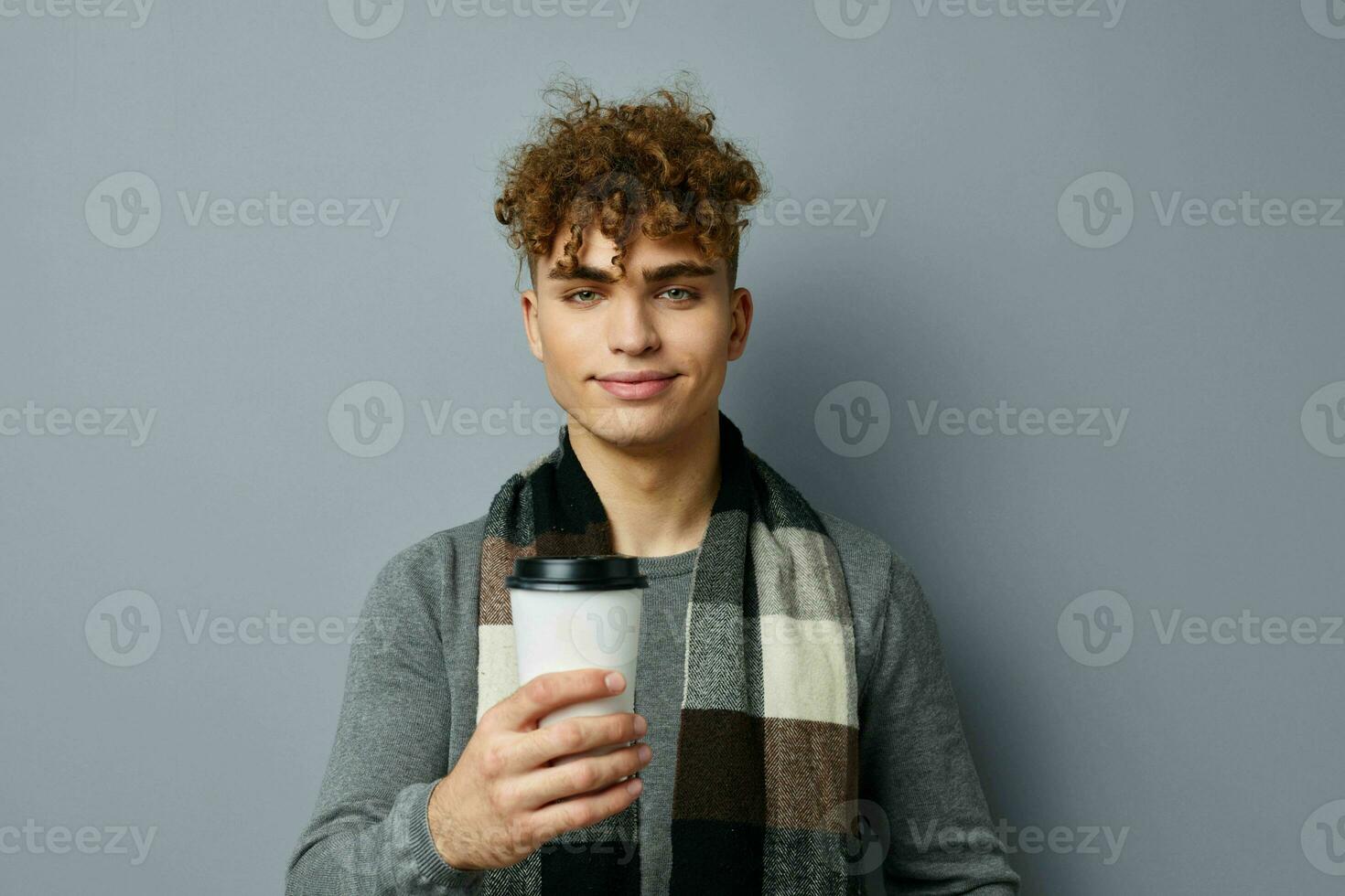 handsome young man elegant style glass with drink posing isolated background photo