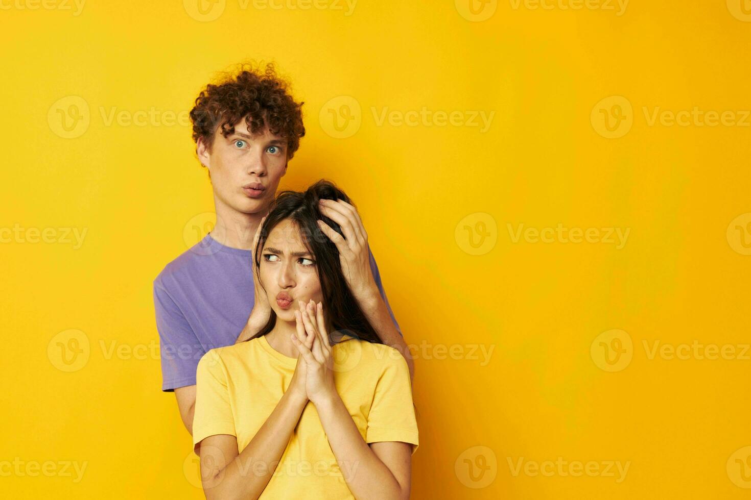 cute young couple casual clothes posing emotions antics isolated background unaltered photo