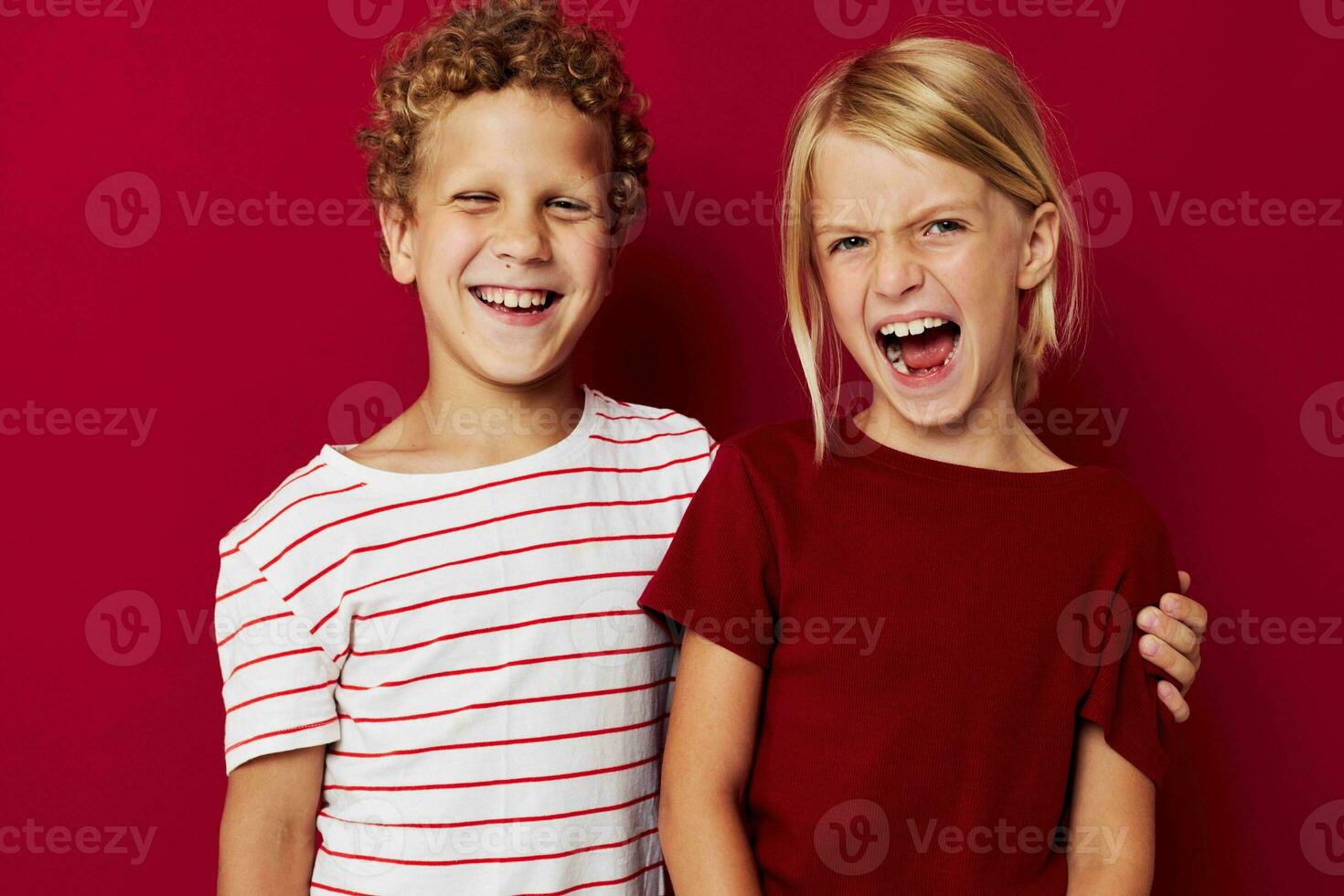 Cute preschool kids emotions stand side by side in everyday clothes red background photo