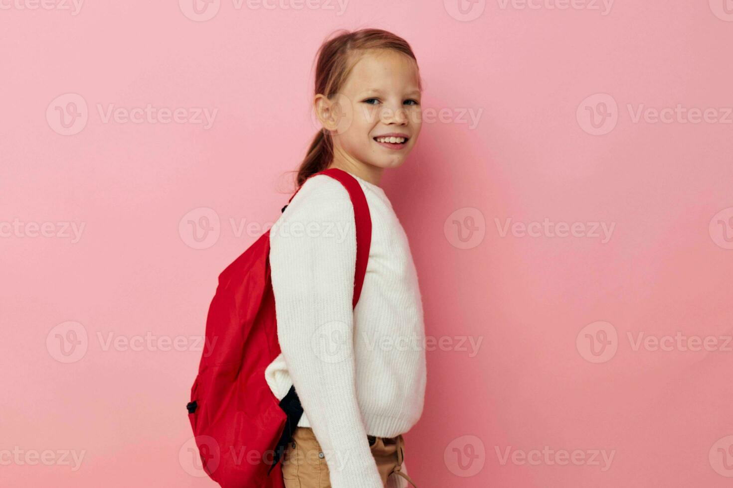 Portrait of happy smiling child girl with a skateboard in hand Lifestyle unaltered photo