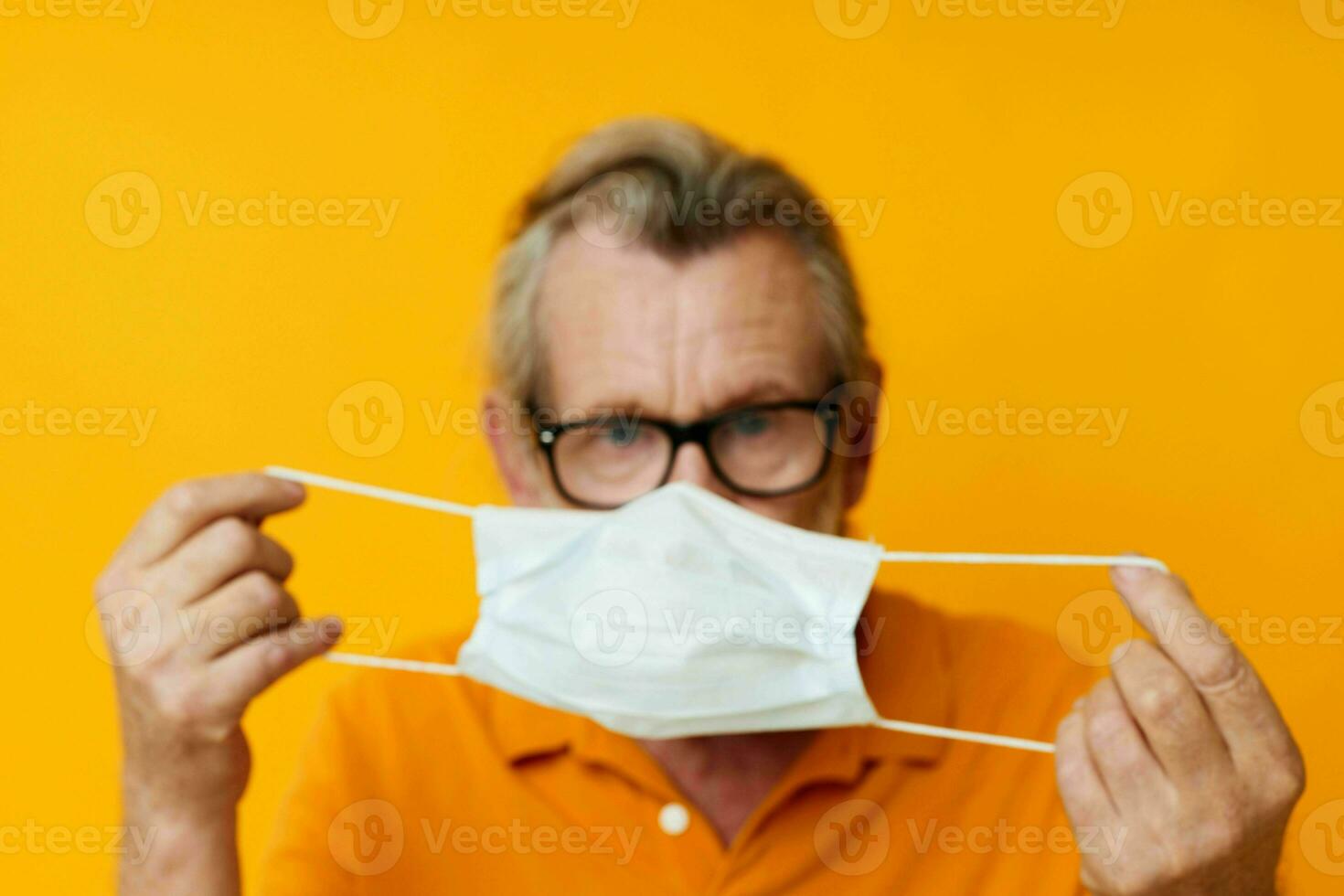 Photo of retired old man with glasses face shield safety monochrome shot