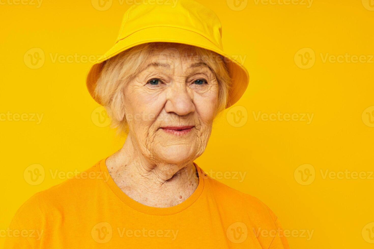 smiling elderly woman posing face grimace joy isolated background photo
