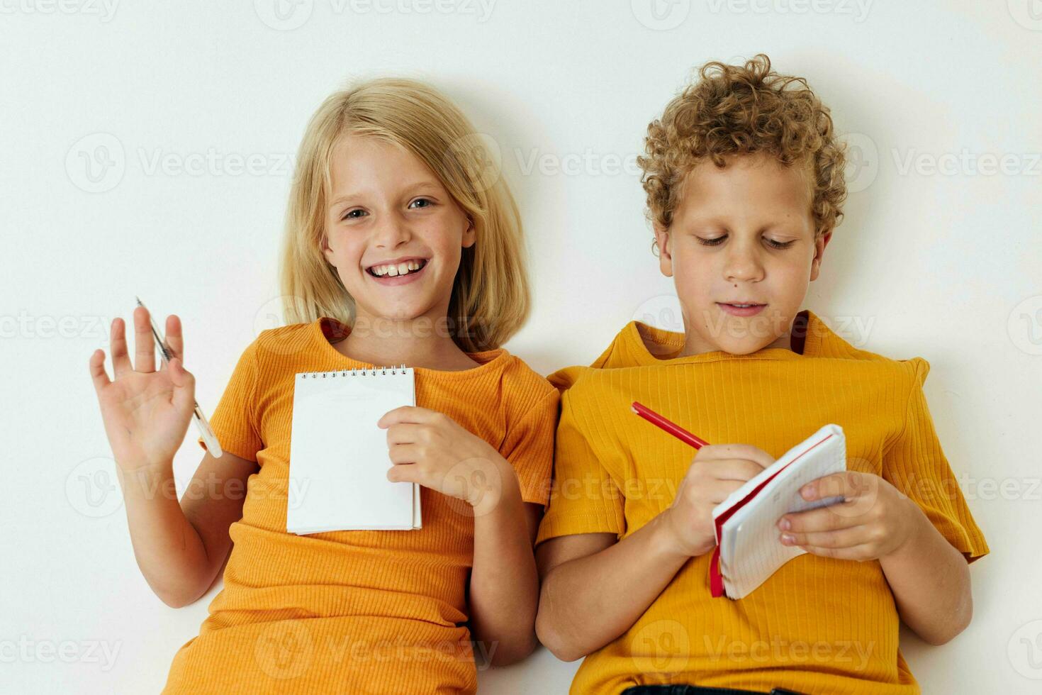 Small children drawing fun games with notepad isolated background unaltered photo