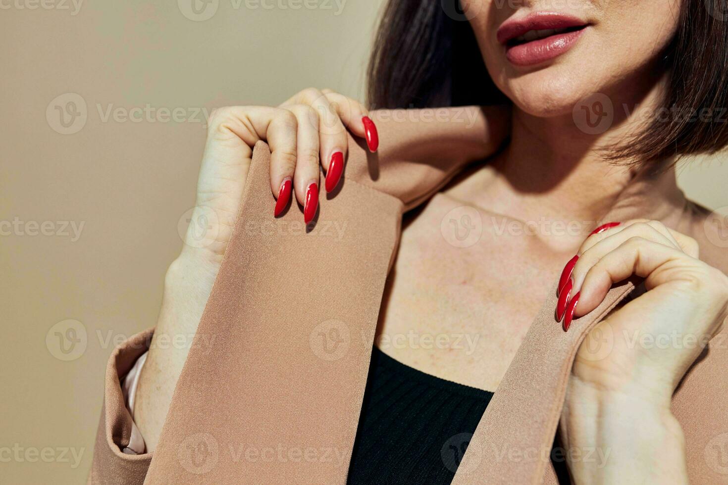 portrait of a woman short haired suit gesturing with hands light background photo