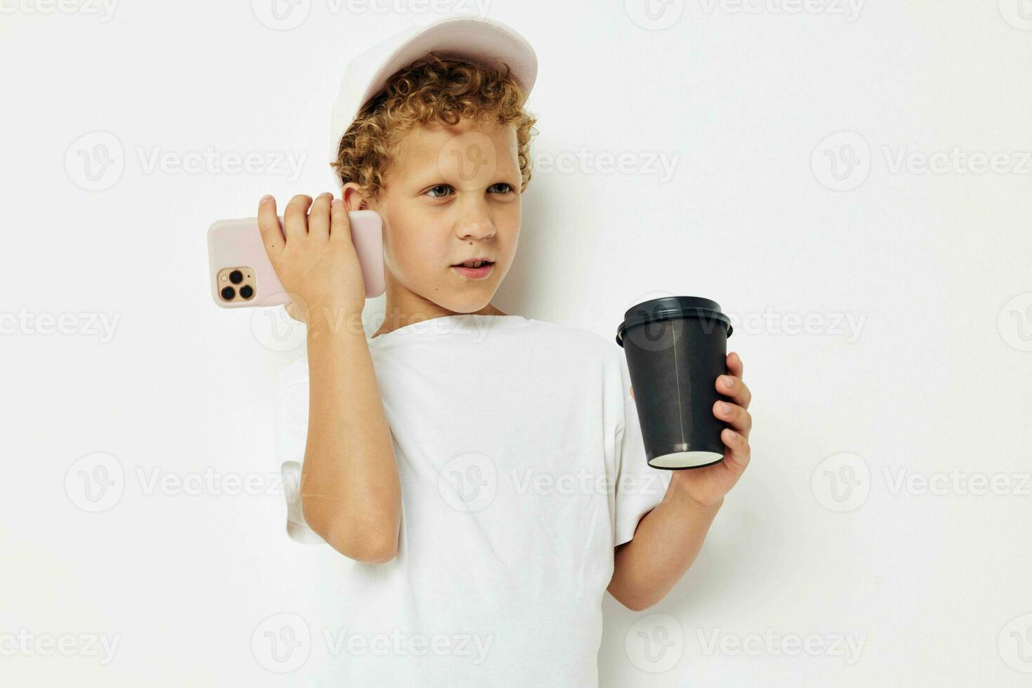 Cute little boy talking on the phone with a black glass light background unaltered photo