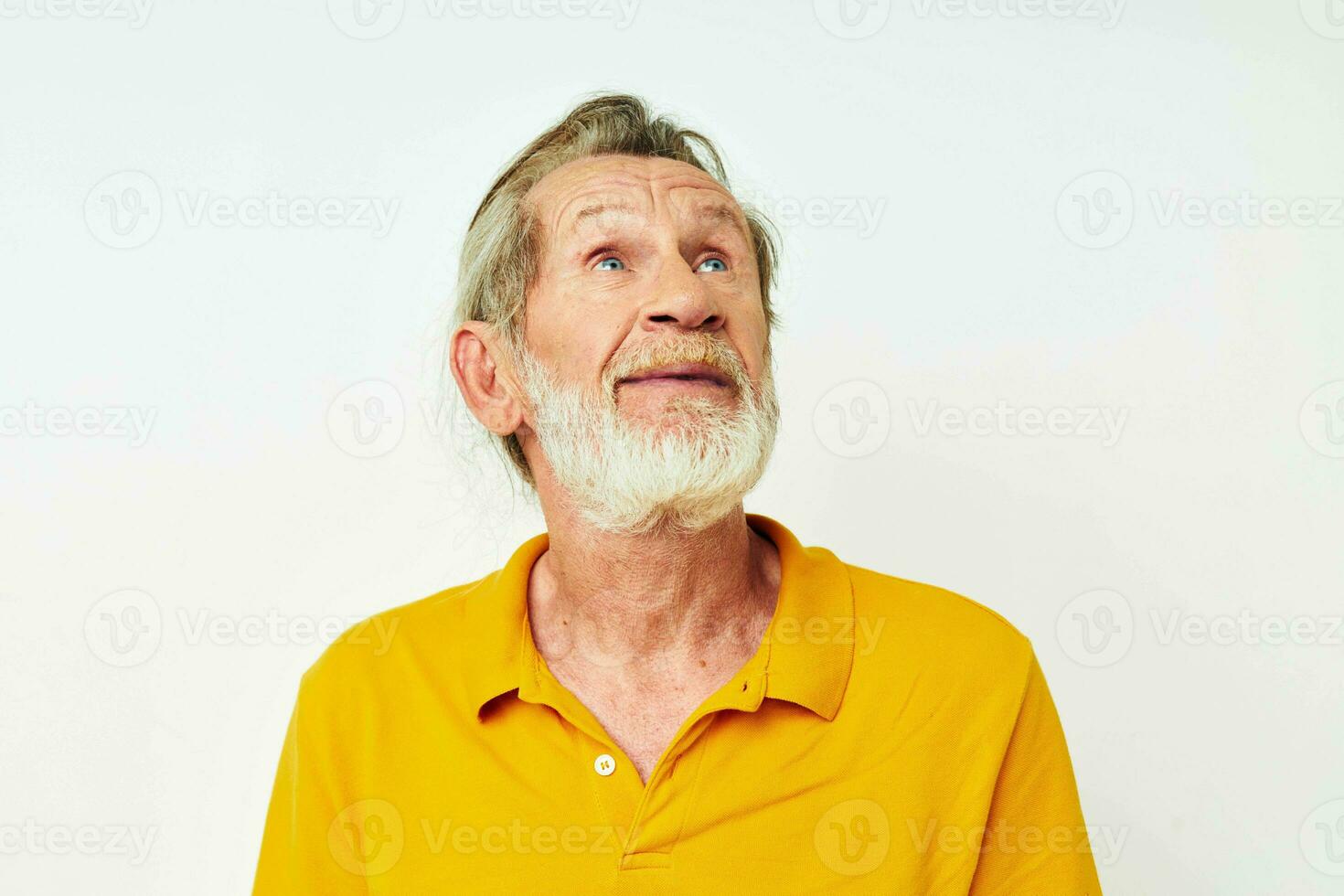 Photo of retired old man with a gray beard emotion gestures hands light background