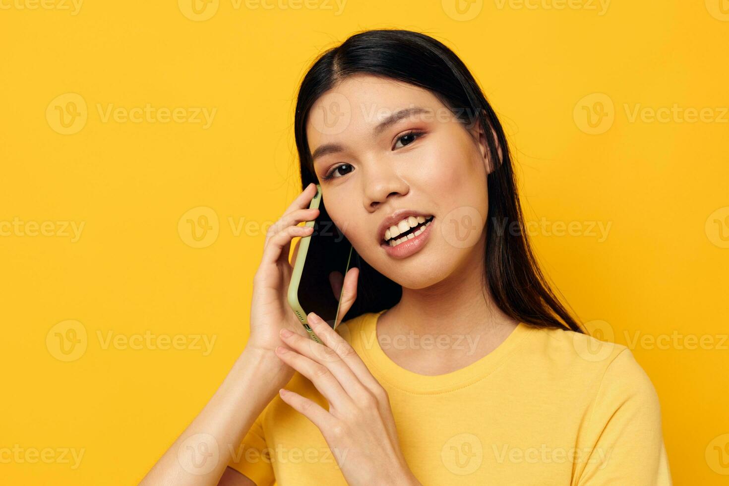 woman with Asian appearance communicates on the phone emotions Lifestyle unaltered photo