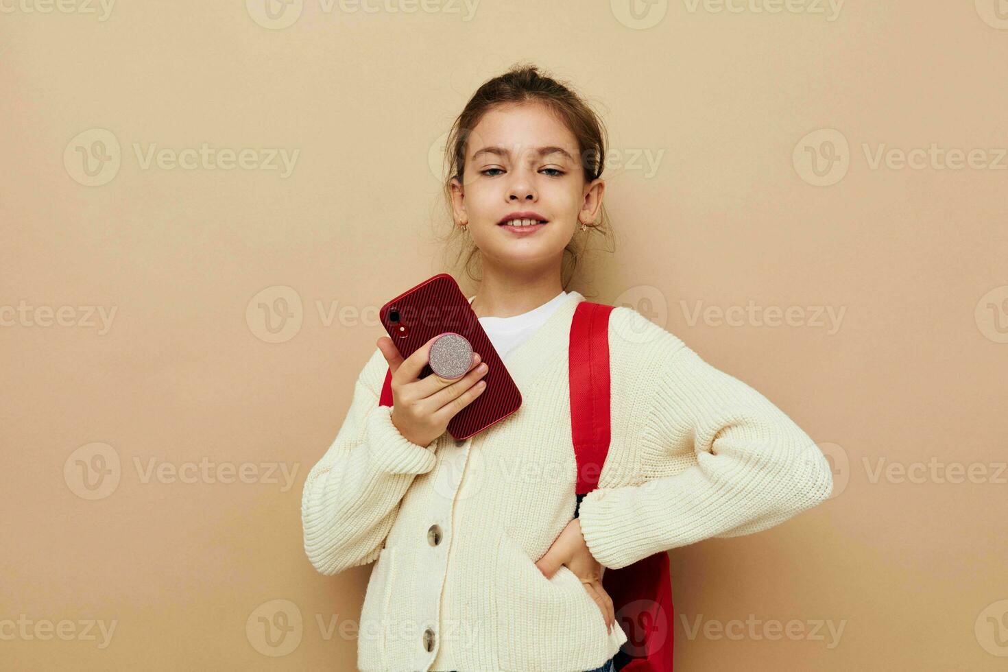 cute girl with phone posing red backpack Lifestyle unaltered photo