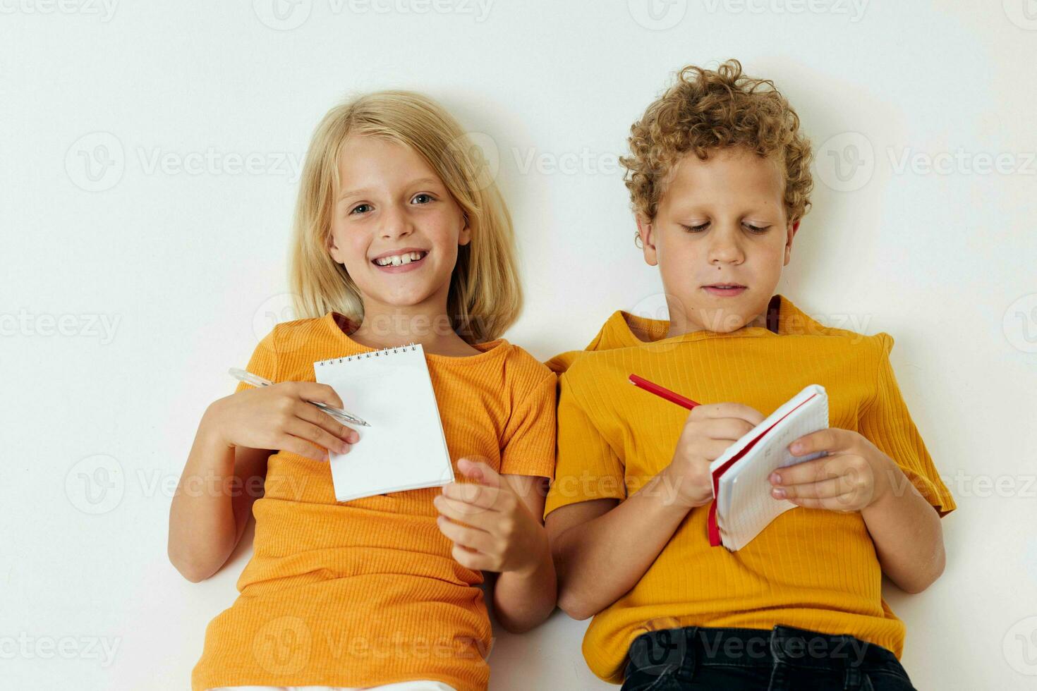 Cute stylish kids drawing fun games with notepad isolated background unaltered photo