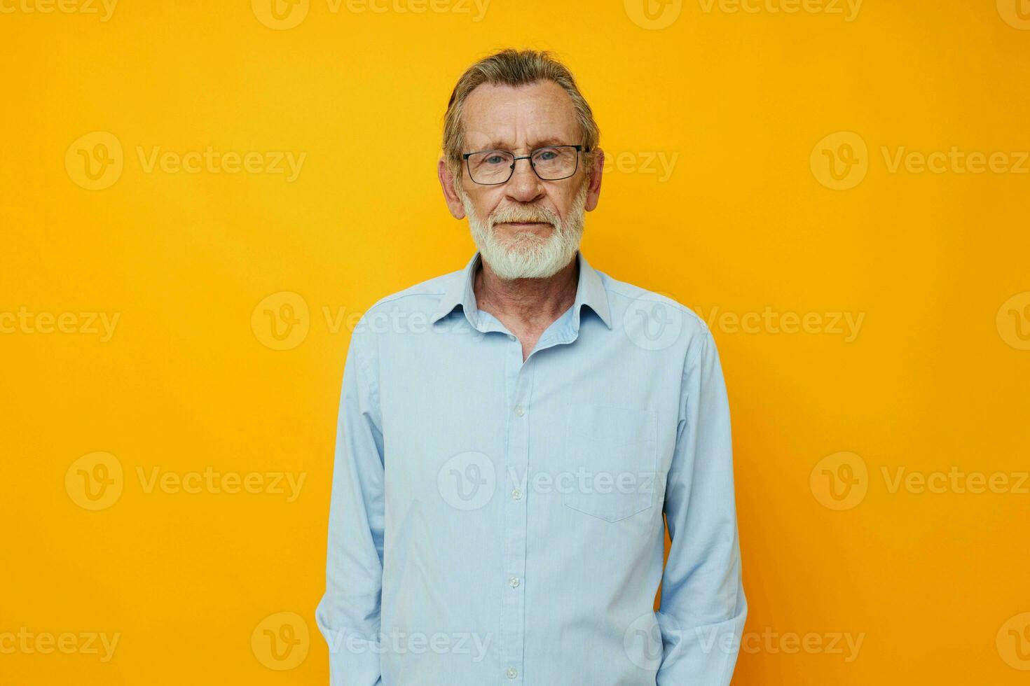 Senior grey-haired man talking on the phone emotions isolated background photo