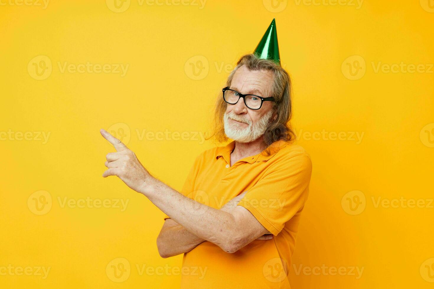 old man wearing glasses green cap on his head holiday emotions isolated background photo