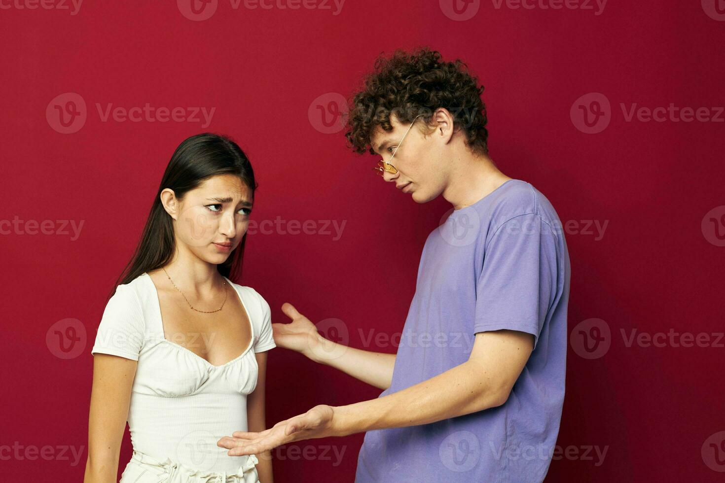 Man and woman hand gesture fun friendship red background photo