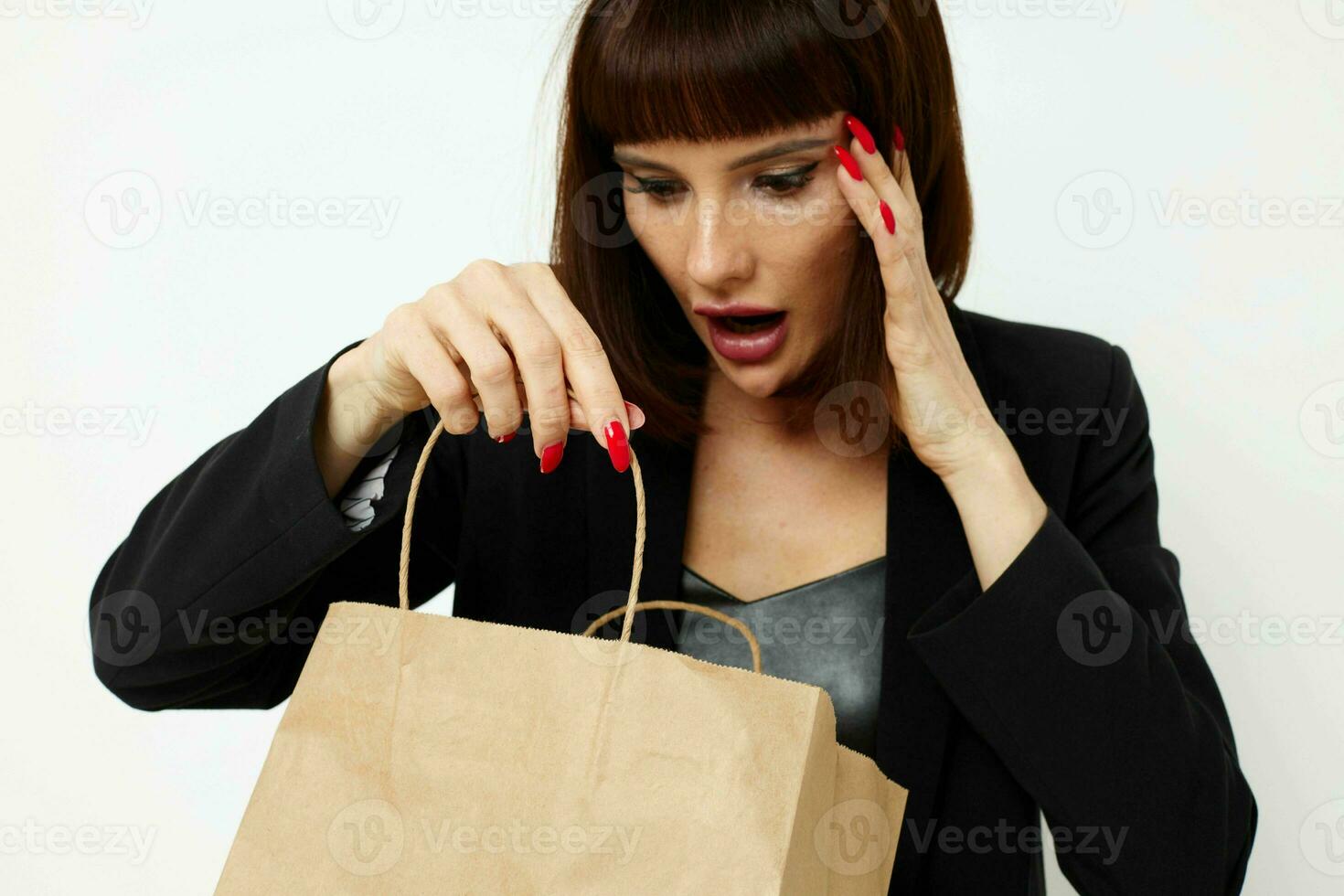 beautiful woman in a black short-haired suit paper bag isolated background photo