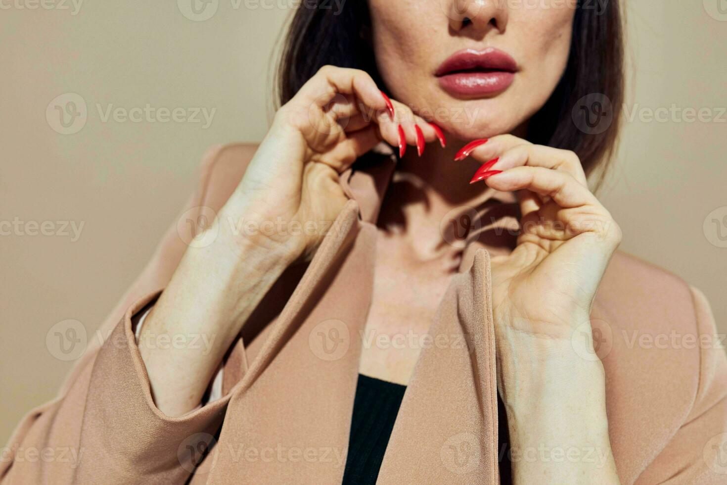 beautiful woman short haired suit gesturing with hands light background photo