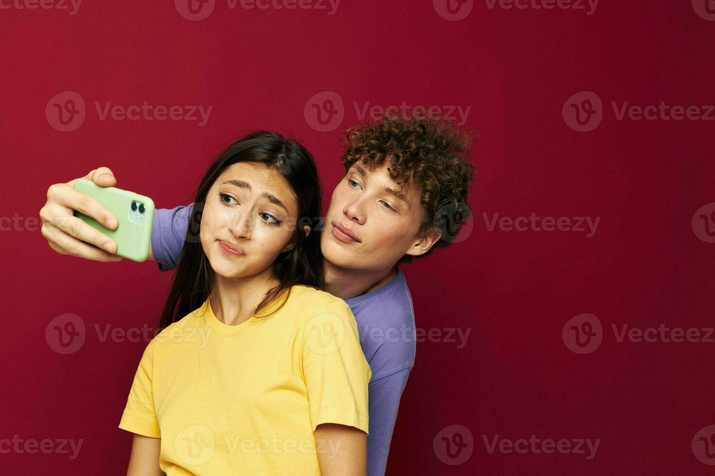 young man and girl take a selfie posing hug isolated background photo