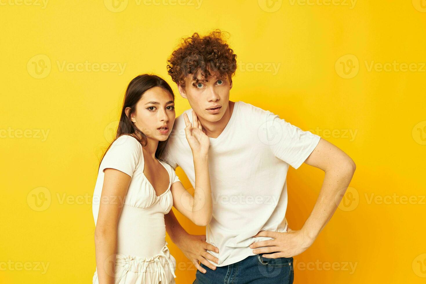 teenagers standing side by side in white t-shirts posing Lifestyle unaltered photo