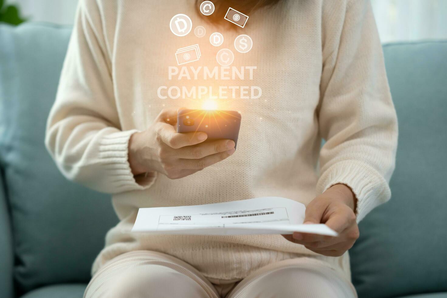 woman use phone to scan barcode or QR codes to pay credit card bill after receiving document invoice online. payment, receive, paying electricity, digital payments, technology, scanning, transactions photo