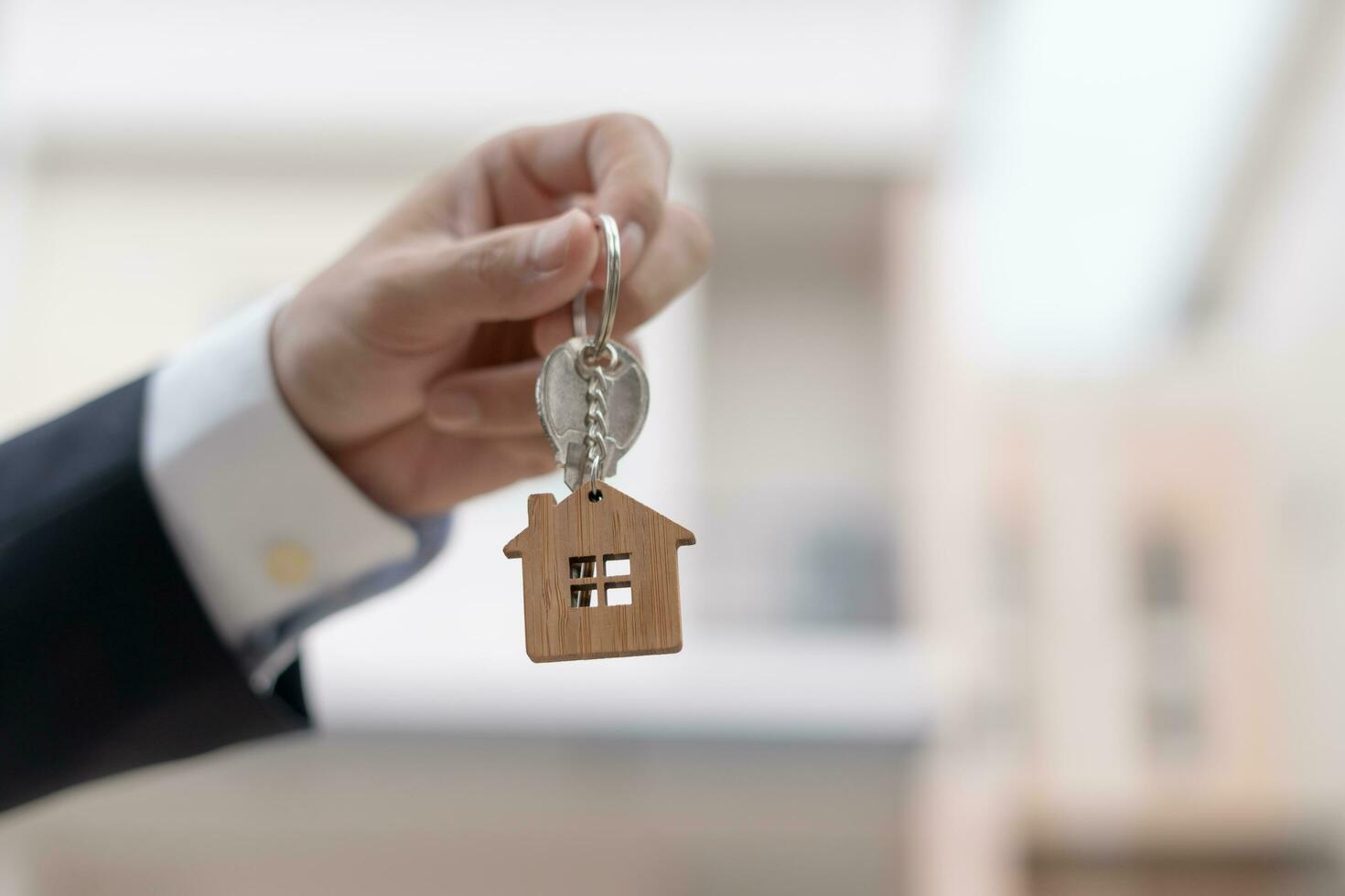 lease, rental and selling home. Real estate agent manager smile holding key for new owner.  rent house, Sales, loan credit financial, insurance, Seller, dealer, installment,  buy, sell, move in photo